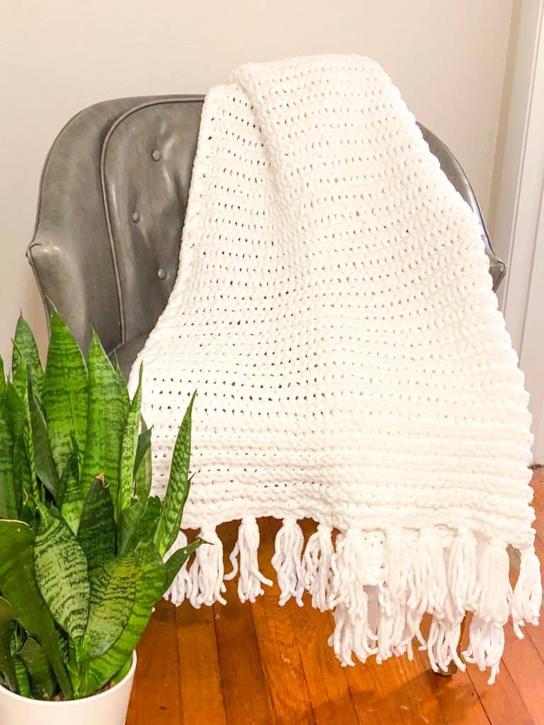 Check out this quick and easy crochet blanket pattern. Perfect size for a king sized bed throw and makes a gift everyone would love. This farmhouse style blanket is made using super bulky Bernat Baby Blanket yarn. Gift tags are included in low cost ETSY pattern purchase. 
